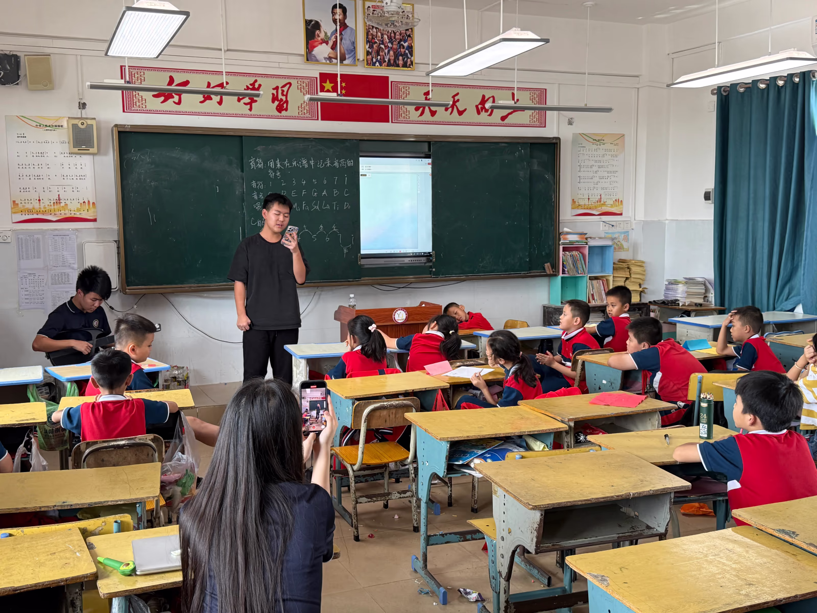 Students participating in a Hainan classroom activity